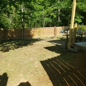 Simply Green - a backyard with a wooden fence - Lawn Services Near Me - Tyler, Texas Simply Green - a backyard with a wooden fence - Lawn Services Near Me - Tyler, Texas