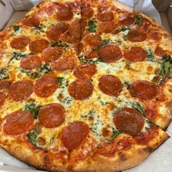 DJ's Pizza - Pepperoni and spinach medium pizza.