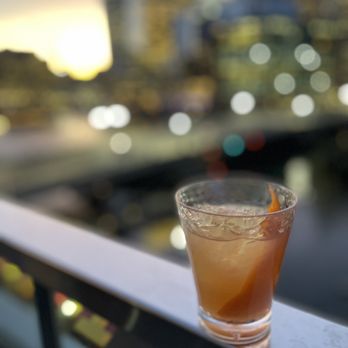 Lookout Rooftop - a drink on a balcony overlooking a city - Bars Near Me - Boston, Massachusetts Lookout Rooftop - a drink on a balcony overlooking a city - Bars Near Me - Boston, Massachusetts