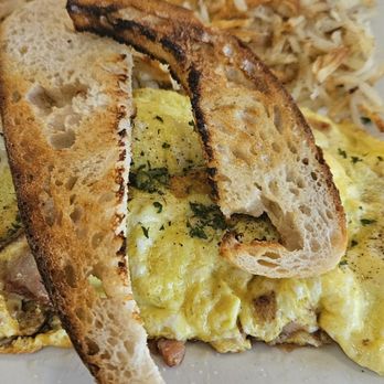 Southern Spoon - My sourdough toast that was supposed to be rye that came with my breakfast. - Breakfast & Brunch Near Me - Middleville, Michigan Southern Spoon - My sourdough toast that was supposed to be rye that came with my breakfast. - Breakfast & Brunch Near Me - Middleville, Michigan