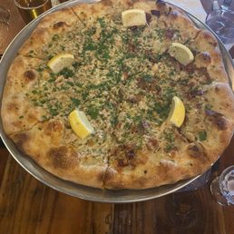 Clam pizza, half with bacon & half without. It's a delicious delight!