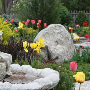 Masterpiece Landscaping - a garden with a birdbath and tulips - Landscaping Near Me - Minnetonka, Minnesota Masterpiece Landscaping - a garden with a birdbath and tulips - Landscaping Near Me - Minnetonka, Minnesota