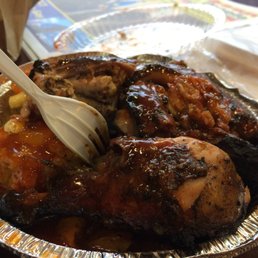 Jerk Chicken, Mac & Cheese, and mixed veggies burried somewhere down there.