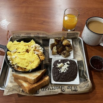 Cast Iron Cafe - Chilaquiles with scrambled eggs ( added) with roasted potatoes, black refried beans, toast, and raspberry jam (jam also added). - Coffee & Tea Near Me - Pharr, Texas Cast Iron Cafe - Chilaquiles with scrambled eggs ( added) with roasted potatoes, black refried beans, toast, and raspberry jam (jam also added). - Coffee & Tea Near Me - Pharr, Texas