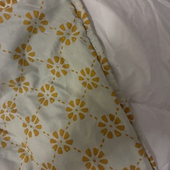 Rinse - a once white pillow sham clearly washed with something dark - Dry Cleaning Near Me - Boston, Massachusetts