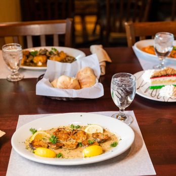 Mama Lisa Restaurant - a table set for a meal - Pizza Near Me - Mastic, New York Mama Lisa Restaurant - a table set for a meal - Pizza Near Me - Mastic, New York
