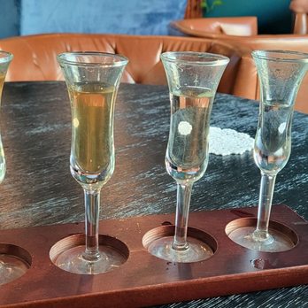 Spirit House Distillery - From left to right there is the whiskey, aged rum, gin, and vodka. All distilled by the Spirit house. - Distilleries Near Me - Menominee, Michigan