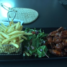 Stick chicken wings with fries and salad. 22 AUD, no drink included. Stick chicken wings with fries and salad. 22 AUD, no drink included.