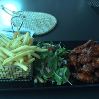 Seventy 7 Cafe & Bar - Stick chicken wings with fries and salad. 22 AUD, no drink included. - Cafes Near Me - Surfers Paradise, QLD Seventy 7 Cafe & Bar - Stick chicken wings with fries and salad. 22 AUD, no drink included. - Cafes Near Me - Surfers Paradise, QLD