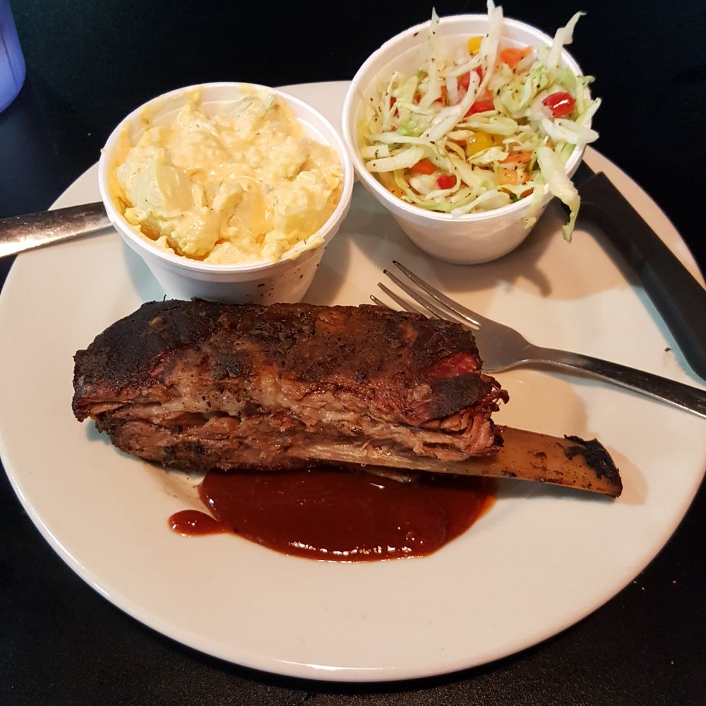 AJ's On Main - One rib with slaw and potato salad. - Barbeque Near Me - Grapevine, Texas