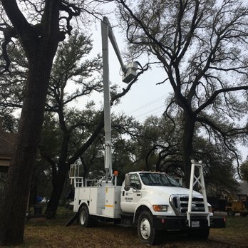 Ortega's Lawn and Landscaping - a white utility truck with a boom - Tree Services Near Me Ortega's Lawn and Landscaping - a white utility truck with a boom - Tree Services Near Me