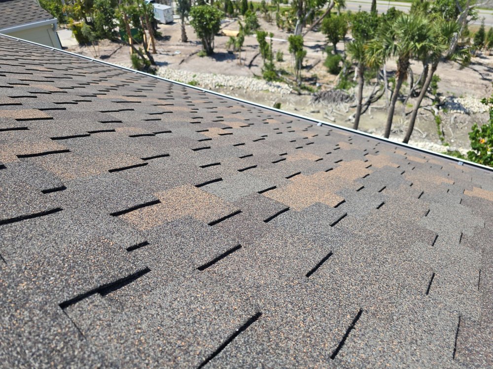 Slide of Rigos Roofing Installers