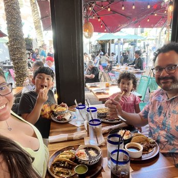 Oh! Mexico - Inside dining area, booth seating. I have tacos al pastor, husband has birria tacos, kids have quesadilla and taquito kids meal. - Mexican Near Me - Miami Beach, Florida