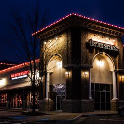 Simply Lit - Strip mall plaza decorated with commercial Christmas lights.