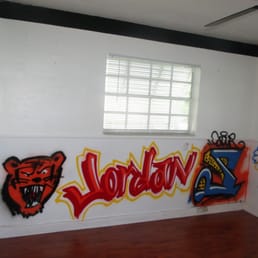 Before photo of our office. There is a chair-rail, spray-painted images, and a black outline around the ceiling. Before photo of our office. There is a chair-rail, spray-painted images, and a black outline around the ceiling.