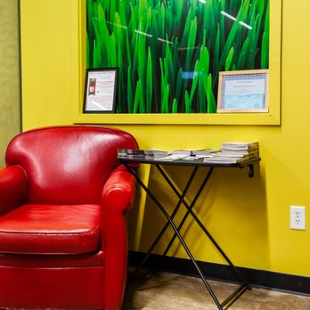 Nature's Cupboard - a red leather chair in a yellow room - Health Markets Near Me - Chesterton, Indiana