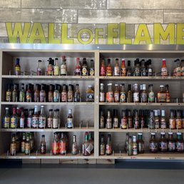 a wall of chili sauces