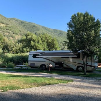 Provo River Resort - Campsite and scenery behind the site - RV Parks Near Me - Wallsburg, Utah
