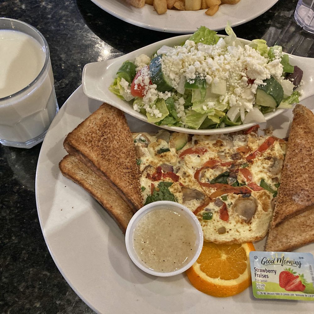 Symposium Cafe Restaurant - Build-Your-Own Omelette (with veggies), toasts, potatoes, side Mediterranean Salad - Breakfast & Brunch Near Me - Waterdown, Ontario Symposium Cafe Restaurant - Build-Your-Own Omelette (with veggies), toasts, potatoes, side Mediterranean Salad - Breakfast & Brunch Near Me - Waterdown, Ontario