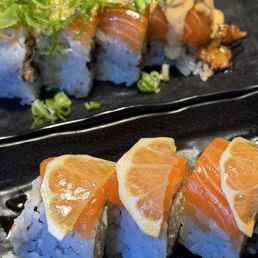 Lemon salmon roll (front), sun of the beach roll (back). Lemon salmon roll (front), sun of the beach roll (back).