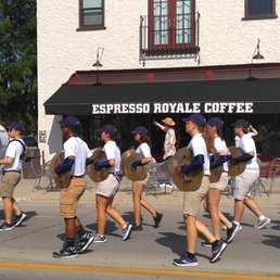 Exterior outside entrance of Espresso Royale Krannert View - On approaching Espresso Royale, I realized I couldn't cross the street just yet and got treated to the Illini marching band going by. - Urbana, Illinois Exterior outside entrance of Espresso Royale Krannert View - On approaching Espresso Royale, I realized I couldn't cross the street just yet and got treated to the Illini marching band going by. - Urbana, Illinois