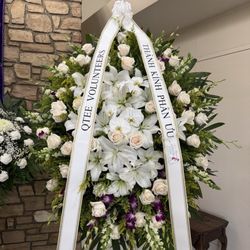 Le's Florist Boutique - Beautiful wreath! Lilies, white roses, white moth orchids, white snapdragons and purple dendrobium orchids