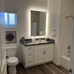 Tuscany Villas by FPI Management - Our master bathroom featuring a hotel-inspired LED mirror. Things are looking BRIGHT at Tuscany Villas!