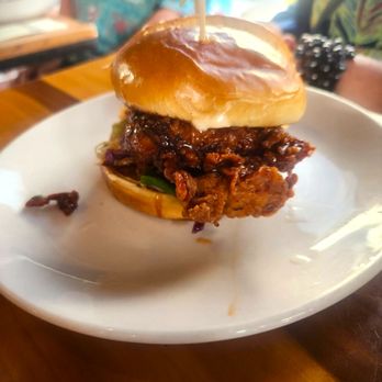Fete - Korean Chicken Sandwich (on an adjacent table) - New American Near Me - Honolulu, Hawaii Fete - Korean Chicken Sandwich (on an adjacent table) - New American Near Me - Honolulu, Hawaii