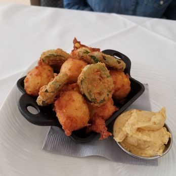 Waters Texas - Roasted corn and cheddar hush puppies with fried jalapeno and Cajun honey butter. FANTASTIC - Seafood Near Me - Fort Worth, Texas Waters Texas - Roasted corn and cheddar hush puppies with fried jalapeno and Cajun honey butter. FANTASTIC - Seafood Near Me - Fort Worth, Texas