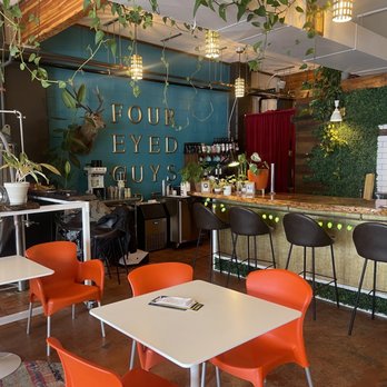 Four-Eyed Guys - a restaurant with tables and chairs - Breweries Near Me - Spokane, Washington