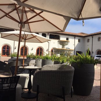 Caffè - a patio area with tables and umbrellas - Coffee & Tea Near Me - Santa Barbara, California