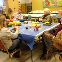 Art House Inc - Community members gathered to help Egyptian Creative Fusion artist Huda Lutfi prep materials for a class.