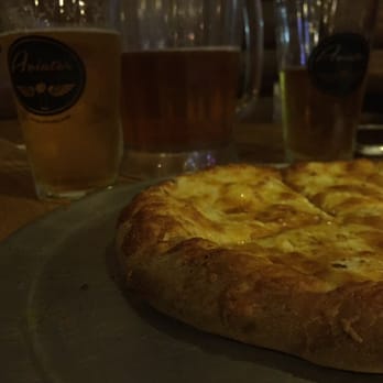 Aviator Pizza & Drafthouse - Garlic sauce four cheese pizza. Delicious. - Pizza Near Me - Elgin, Texas