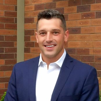 Sunnyside Builders - a man in a blue suit standing in front of a brick wall - General Contractors Near Me - Denver, Colorado Sunnyside Builders - a man in a blue suit standing in front of a brick wall - General Contractors Near Me - Denver, Colorado