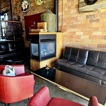 Monk's Ale House - Fireplace, couch & red cushy chairs - New American Near Me - Sioux Falls, South Dakota Monk's Ale House - Fireplace, couch & red cushy chairs - New American Near Me - Sioux Falls, South Dakota