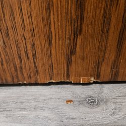 Two Men and a Truck Cedar Rapids - Damage at bottom of desk where they didn't wrap it to the bottom and scraped it on something moving
