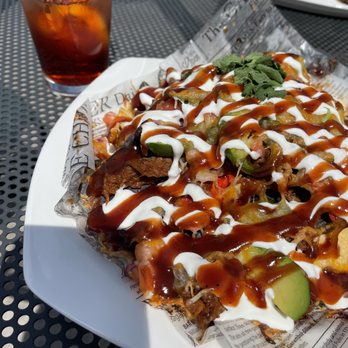 Cantilever Distillery - Pulled Pork Nachos on the patio and raspberry iced tea to drink. The candied jalapenos and dr. pepper pulled pork are out of this world. - New American Near Me - International Falls, Minnesota