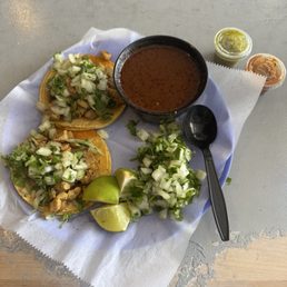 2 chicken tacos and consome no meat,red and green salsa