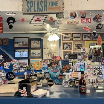 Splash Cafe - Inside the SPLASH cafe 'The Legendary' mirror covered in stickers from people all over the world. - American Near Me - Pismo Beach, California Splash Cafe - Inside the SPLASH cafe 'The Legendary' mirror covered in stickers from people all over the world. - American Near Me - Pismo Beach, California