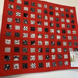Totally Tina’s Fabrics - Displayed in shop: sewn up quilt with pattern available.