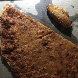 a piece of pizza and a fried chicken a piece of pizza and a fried chicken