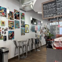 Fillmore Coffee - Side seating area and wall art