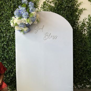VV Tapas Lounge - a woman sitting in front of a sign that says joy bliss - Tapas Bars Near Me - Vancouver, British Columbia