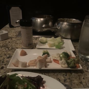 The Melting Pot - The two pots on one burner and salad barely touched, while being pushed to finish these courses. - Fondue Near Me - Destin, Florida The Melting Pot - The two pots on one burner and salad barely touched, while being pushed to finish these courses. - Fondue Near Me - Destin, Florida