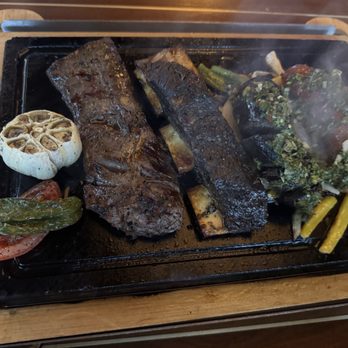Piedra Santa - Parrillada for Two: Skirt Steak, Bone-in Short Rib, Morcilla (blood sausage), and Paisa Chorizo - Steakhouses Near Me - San Diego, California Piedra Santa - Parrillada for Two: Skirt Steak, Bone-in Short Rib, Morcilla (blood sausage), and Paisa Chorizo - Steakhouses Near Me - San Diego, California