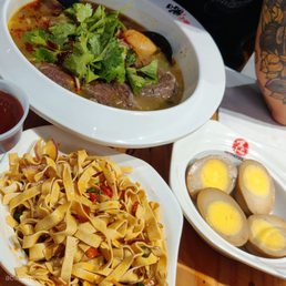Tofu skin $4.99, Marinated egg $0.99/egg, Noodles with Beef Brisket in Suāncài Pickle Soup $13.99
