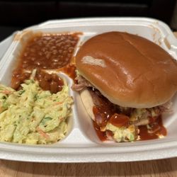 Jumbo pork sandwich with beans and slaw. (To go).