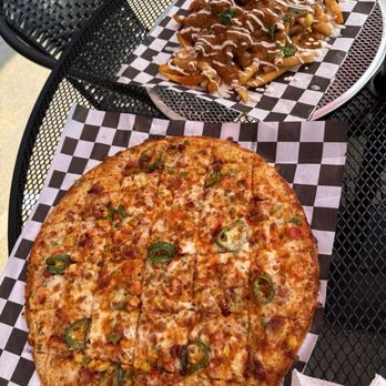 Tikka Tangy - Szechuan pizza and Tikka Masala Loaded Fries - Indian Near Me - Saint Louis, Missouri Tikka Tangy - Szechuan pizza and Tikka Masala Loaded Fries - Indian Near Me - Saint Louis, Missouri