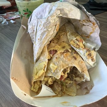 Con Azucar cafe - Burrito not fully wrapped and eggs all over the wrapping and the sides of the burrito - Coffee & Tea Near Me - Bakersfield, California