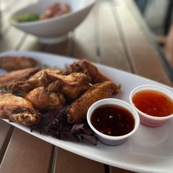 Woody's Ocean Grille - Wings two sauces on side sticky Asian and sweet chili thai. Excellent!!